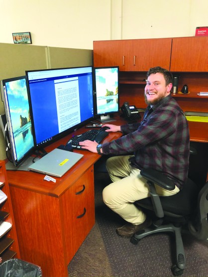 Photo of Dan Asbury at his desk